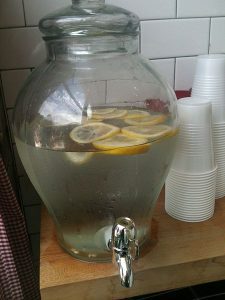 lemon detox water in transparent water dispenser