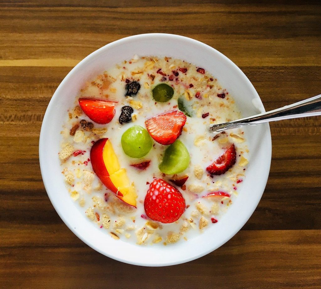 muesli served with milk and fruits
