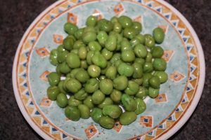 fresh green peas in the ceramic plate