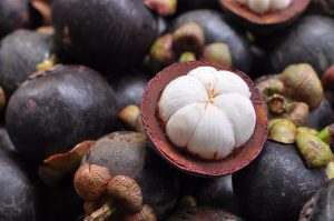 purple mangosteen fruit with a white pulp