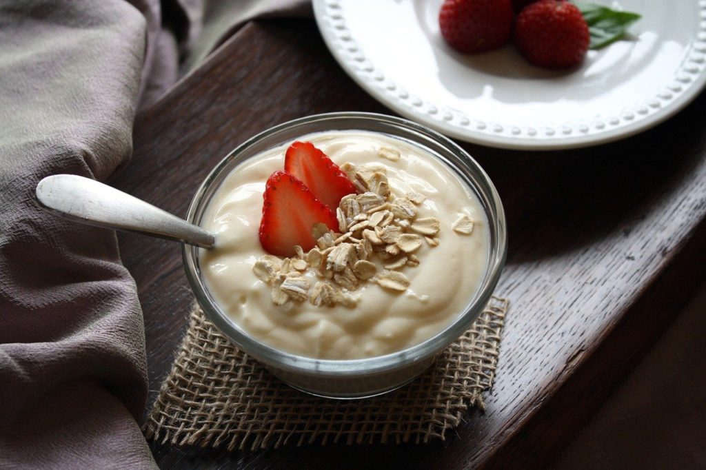 custard topped with strawberry and nuts
