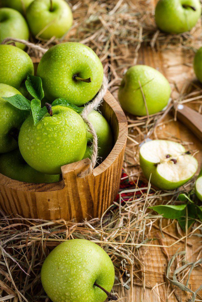 green apples kept in a basket