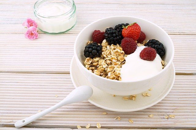 muesli served with yogurt and fresh berries