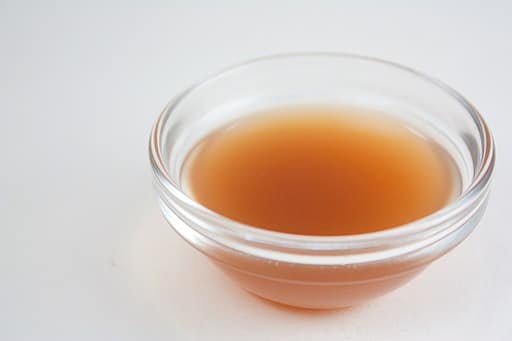 apple cider vinegar in a transparent bowl