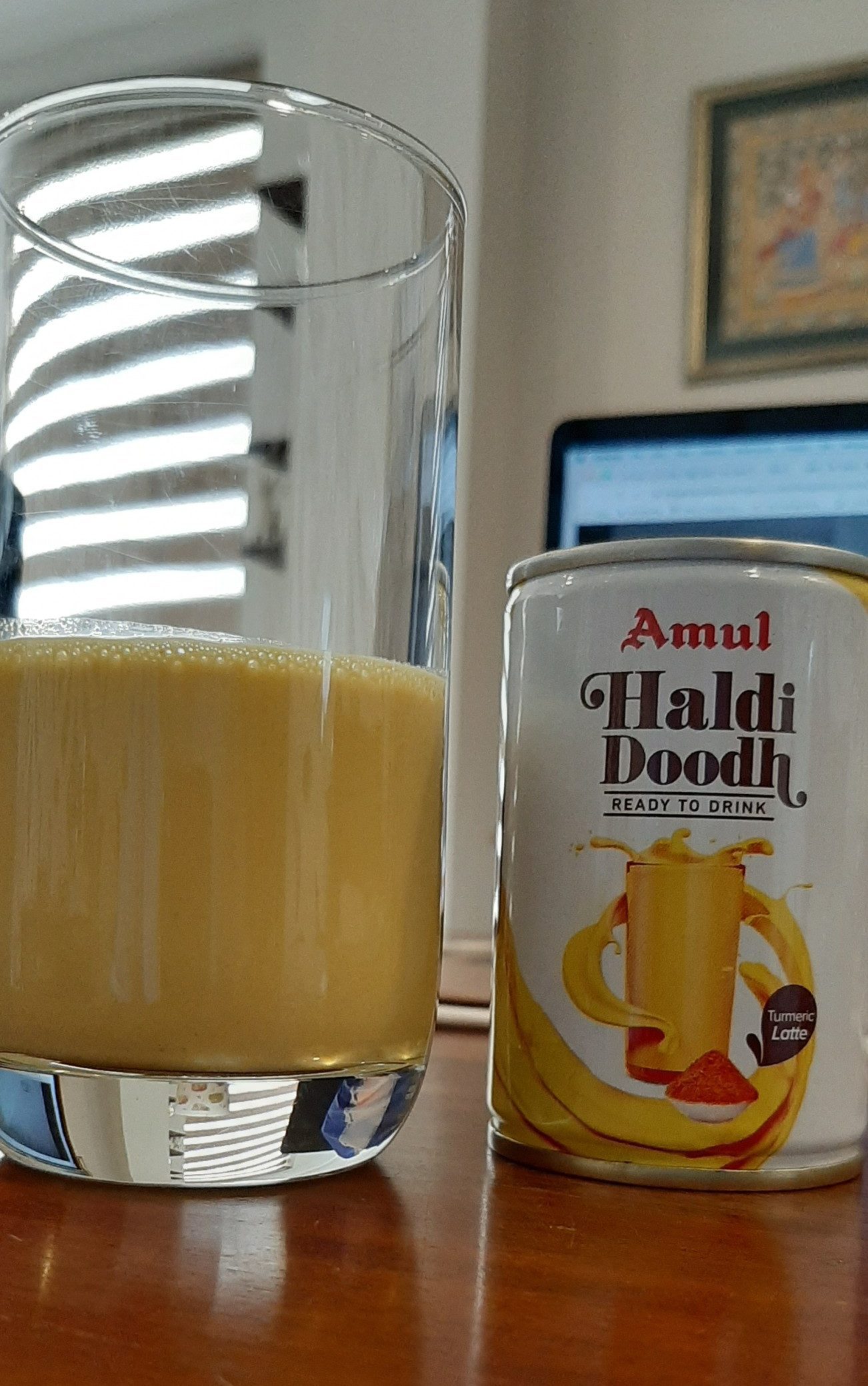 tasting amul haldi doodh in a glass