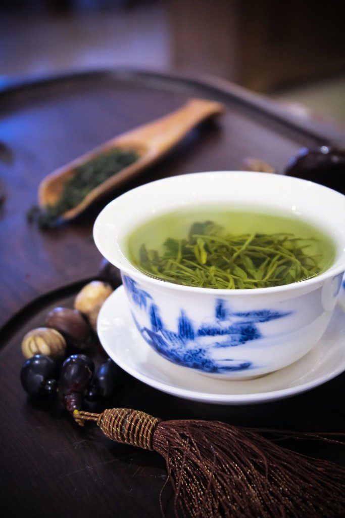 infusing the delightful flavor of green tea in warm water