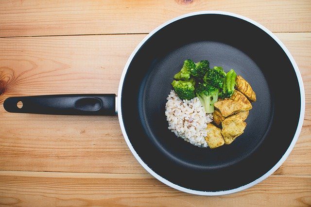 rice, broccoli and chicken in skillet