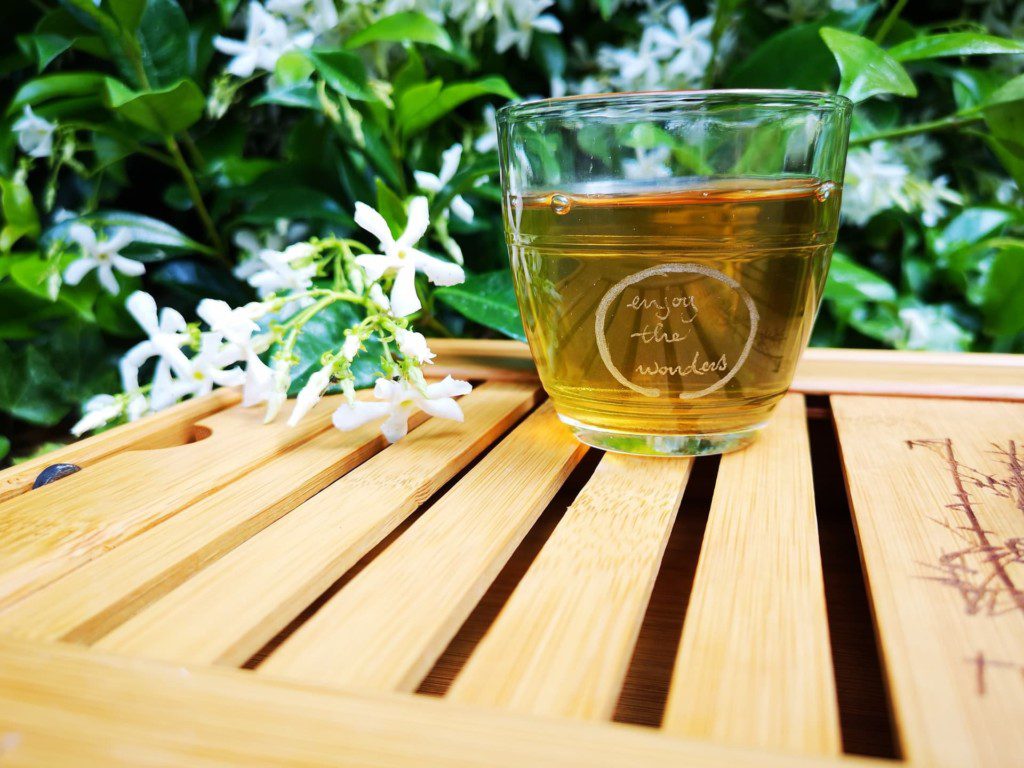 chamomile tea served and kept outdoor on a wooden platform