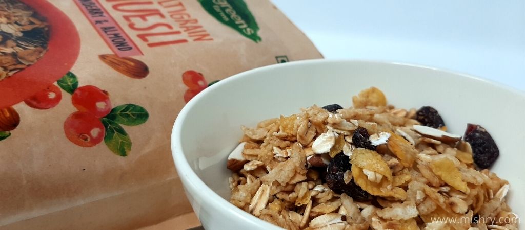 wingreens farms 5 grains muesli with honey, almond & raisins served in a bowl