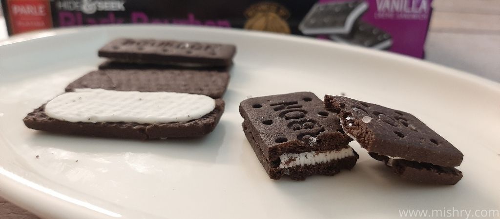 cross sectional view of black bourbon biscuits in a tray