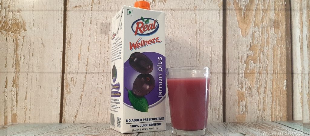 real wellnezz jamun juice contents in a glass