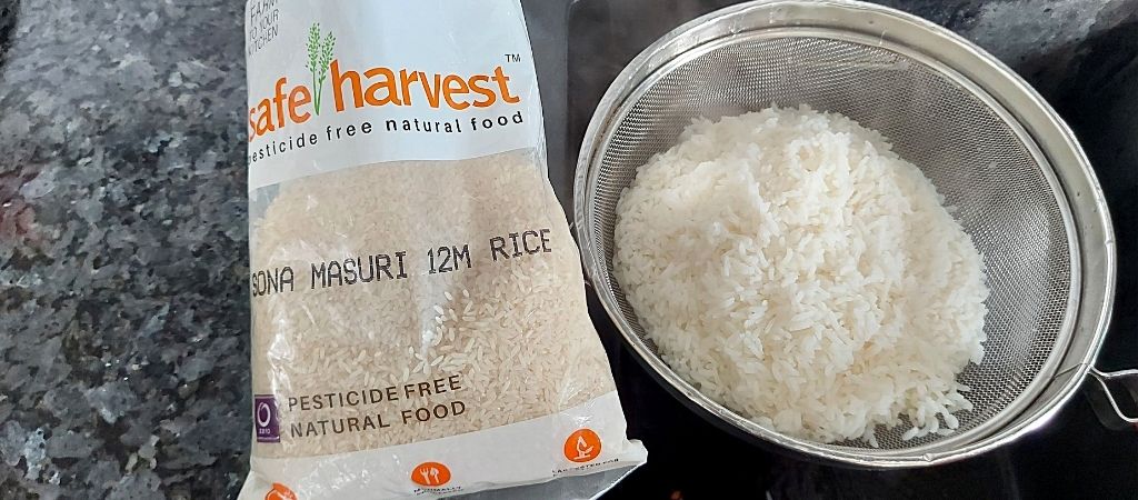 safe harvest sona masuri rice in a strainer