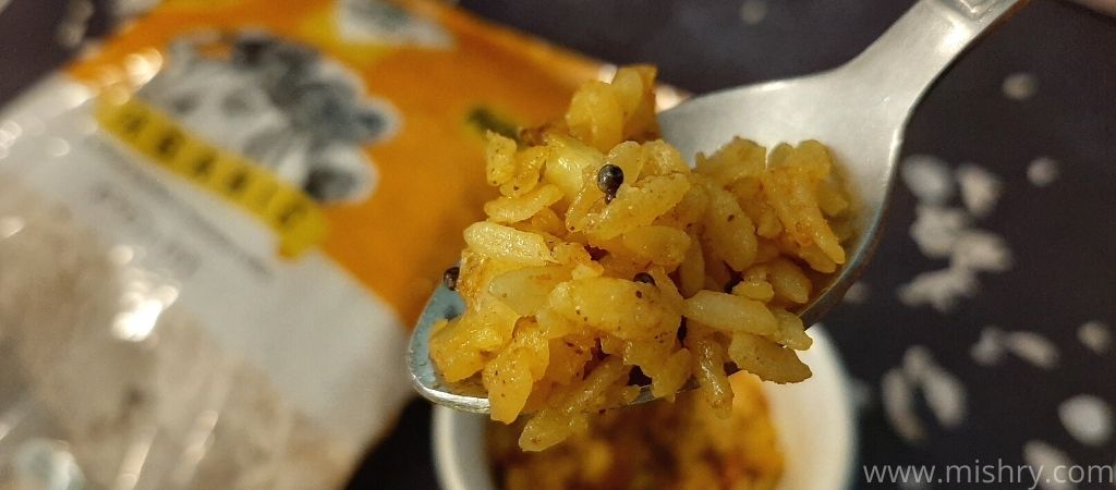 24mantra organic cooked poha on a spoon