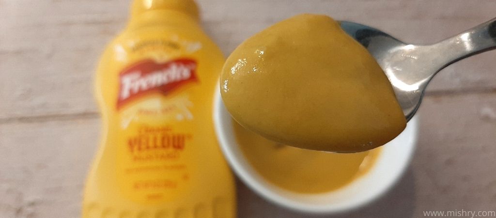 closer look at french’s yellow mustard in a spoon