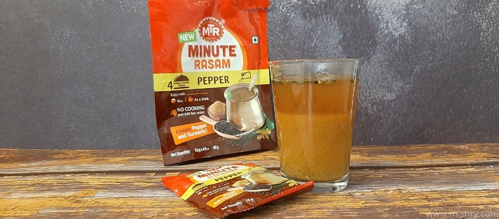 mtr minute pepper rasam filled glass on a table