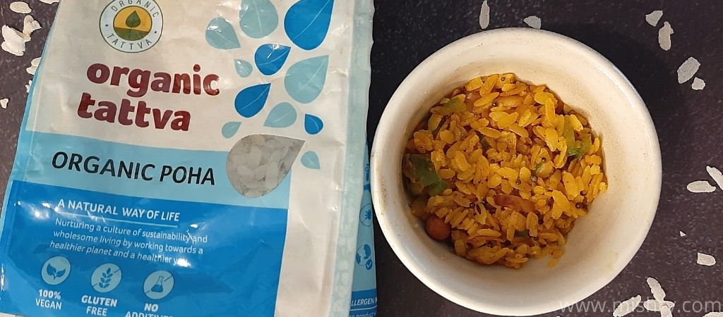 organic tattva organic poha packet with cooked poha in a bowl
