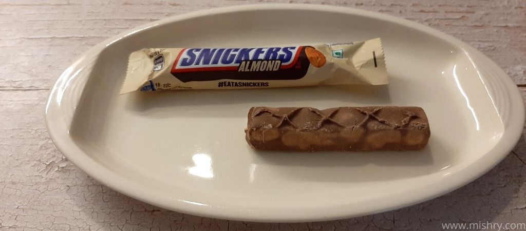 snickers almond chocolate bar on a plate