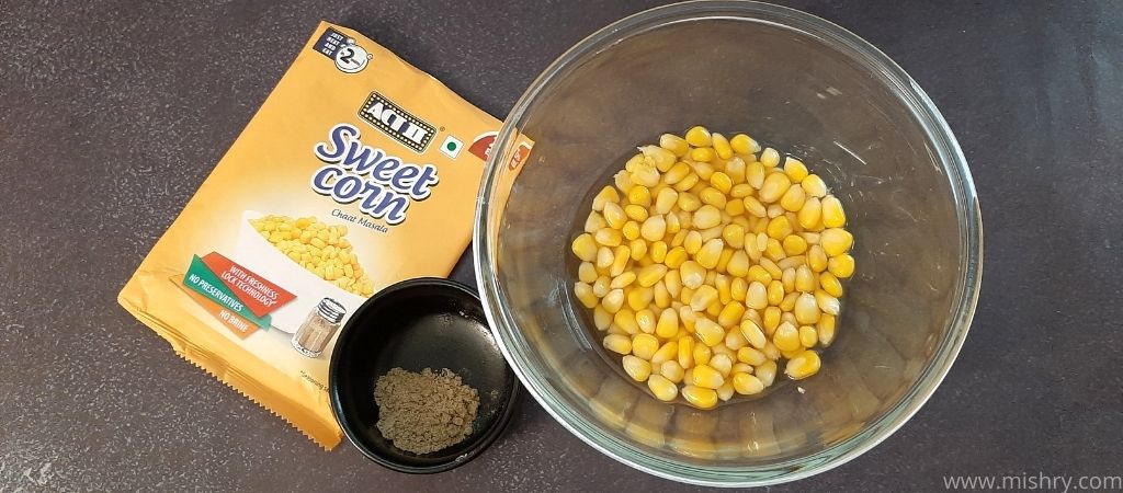 chaat masala sweet corn kernels and seasoning mix in bowls