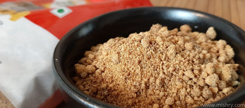 closer look at 24 mantra organic jaggery powder in a bowl