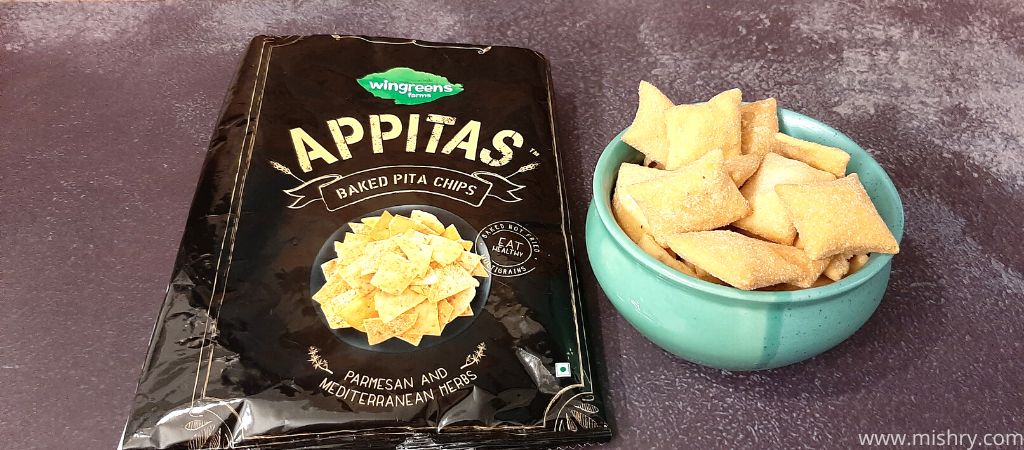 wingreens farms appitas parmesan and mediterranean herbs baked pita chips placed in a bowl